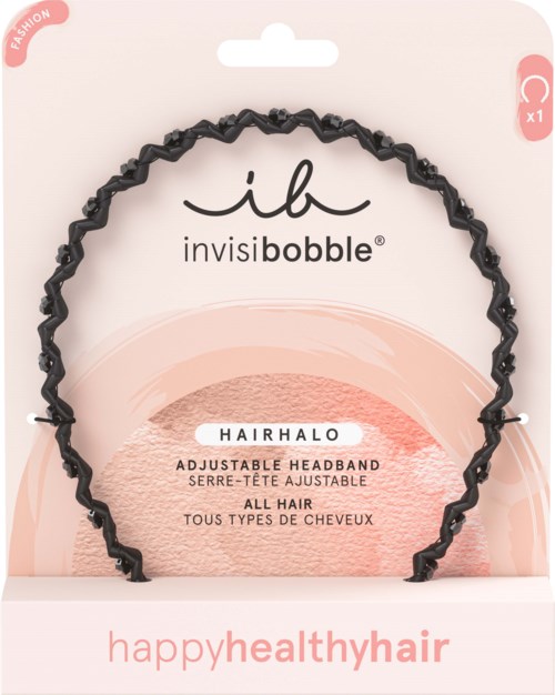 A flexible, adjustable black headband in packaging with soft pink and peach colors, promoting healthy hair.