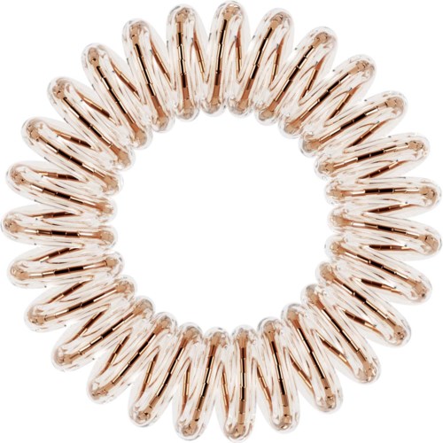 En rund hårsnodd med rosa-beige spiraler som är avsedda att hålla håret i en hästsvans eller knut.