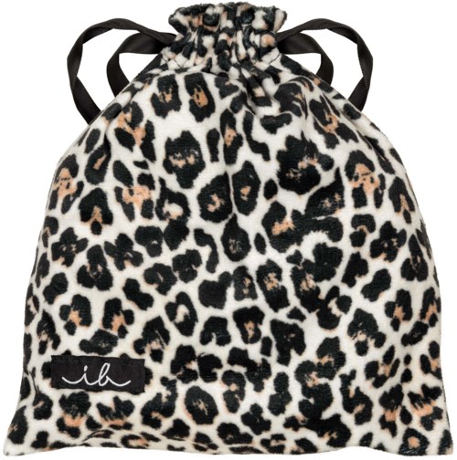 A leopard print drawstring bag with black ties and a small black label reading "ilk."