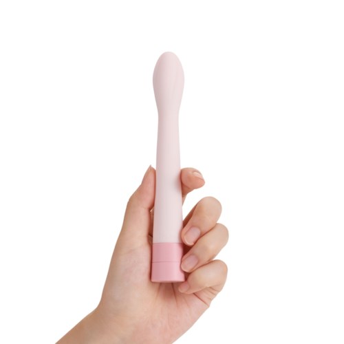 Eine Hand hält einen pinken, gebogenen, stabähnlichen Gegenstand mit einer Kugel an der Spitze.