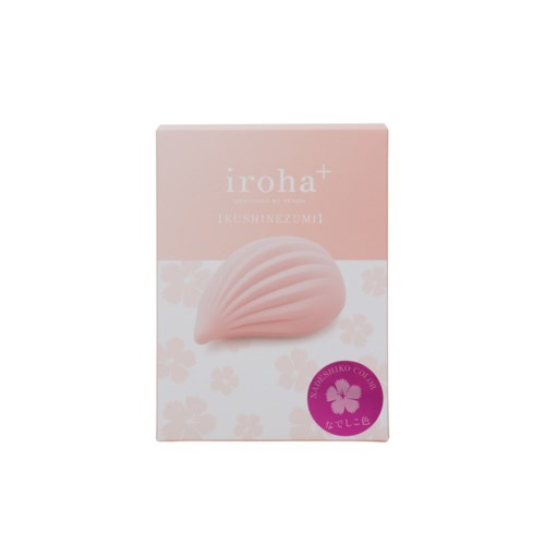 Eine rosa Schachtel mit einem muschelähnlichen Gegenstand und Blumenmustern, mit Text und einem lila Siegel am unteren Rand.