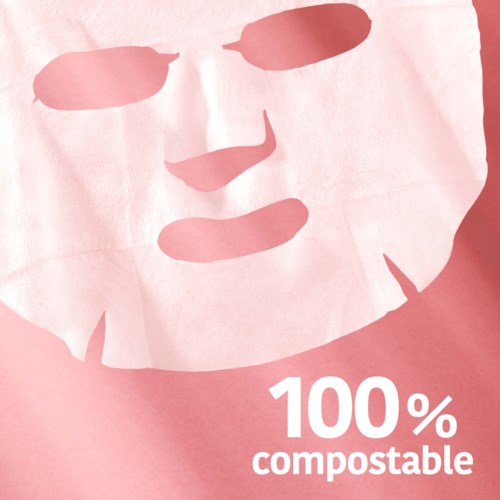 Iemand draagt een wit gezichtsmasker. Tekst op de afbeelding zegt '100% biologisch afbreekbaar'.