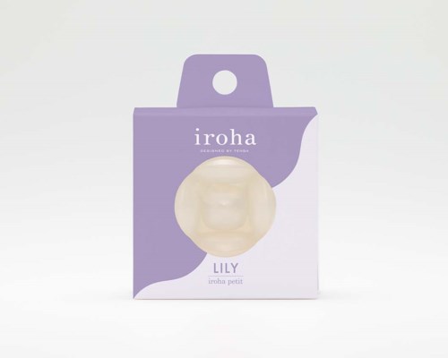Das Bild zeigt eine lavendelblaue Verpackung mit einem runden, cremefarbenen Gegenstand darin, beschriftet mit 'iroha' und 'LILY'.