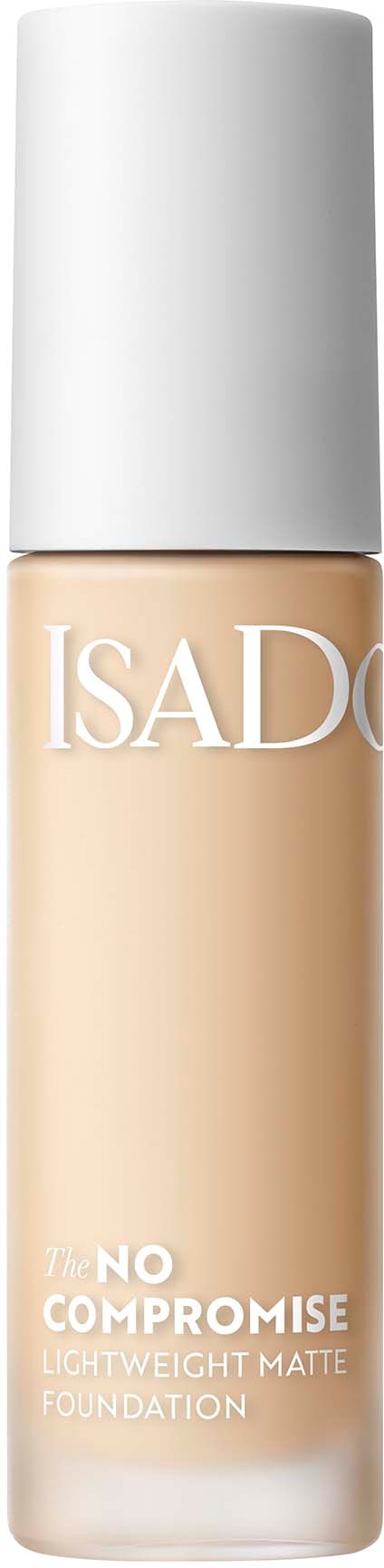 En flaska av Isadore lättfundation med vit lock och beige vätska inuti.