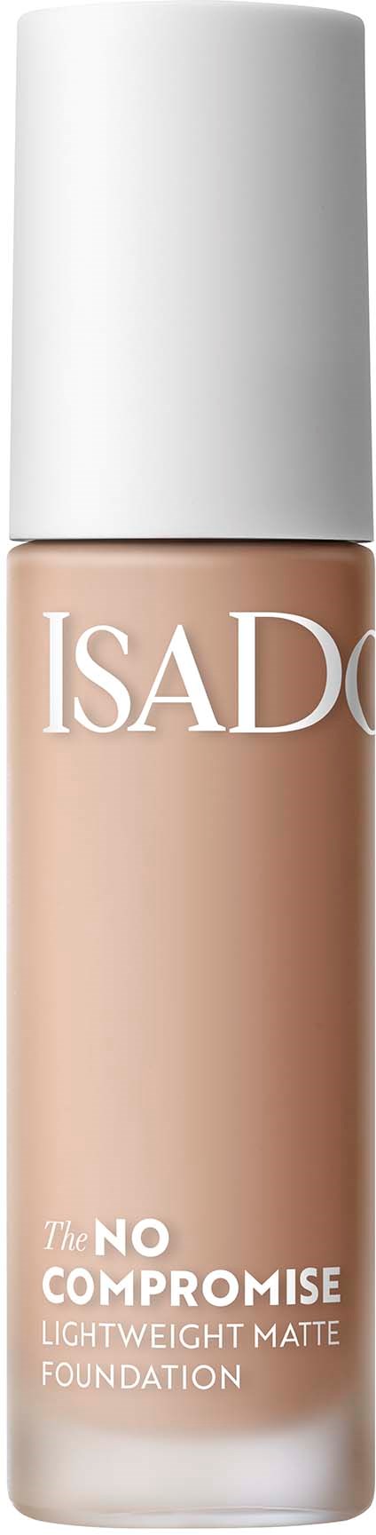 En flaska av flytande foundation märkt ISAD, med vit kork och beige produkt inuti.