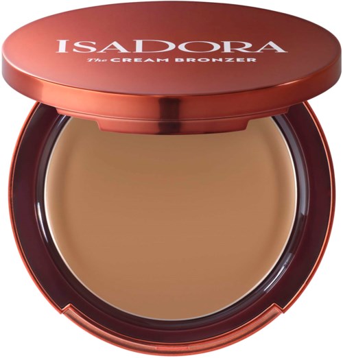 A round, peach-colored compact with a lid that says 'ISADORA The CREAM BRONZER.'