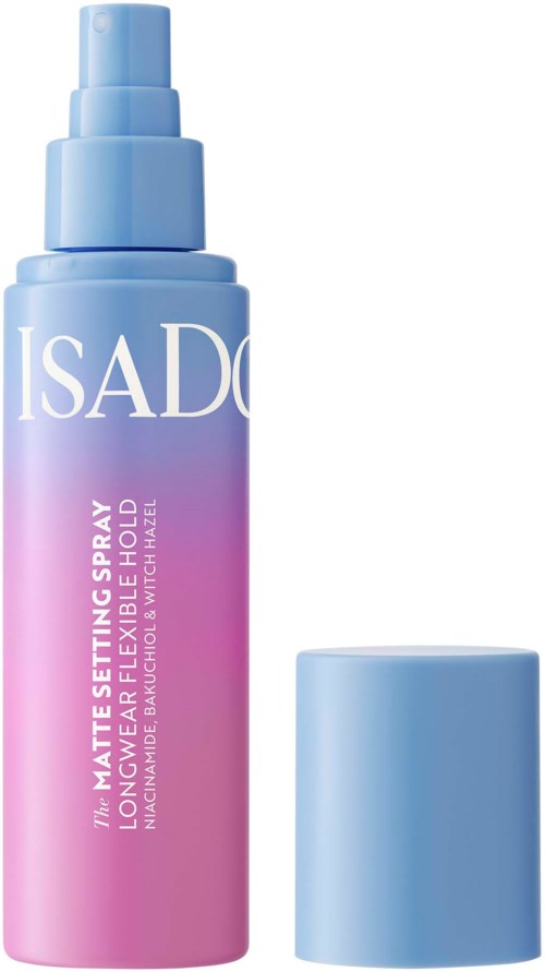 Blaue und rosa Flasche mit Spraykopf, beschriftet 'ISADORE' für lang anhaltenden matten Halt. Deckel daneben.