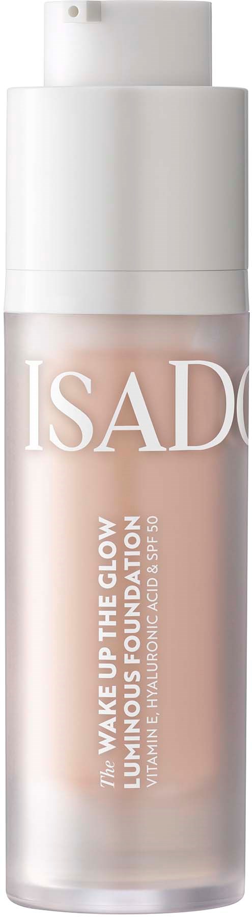 A bottle of Isadore glow foundation with a white cap and beige liquid inside.