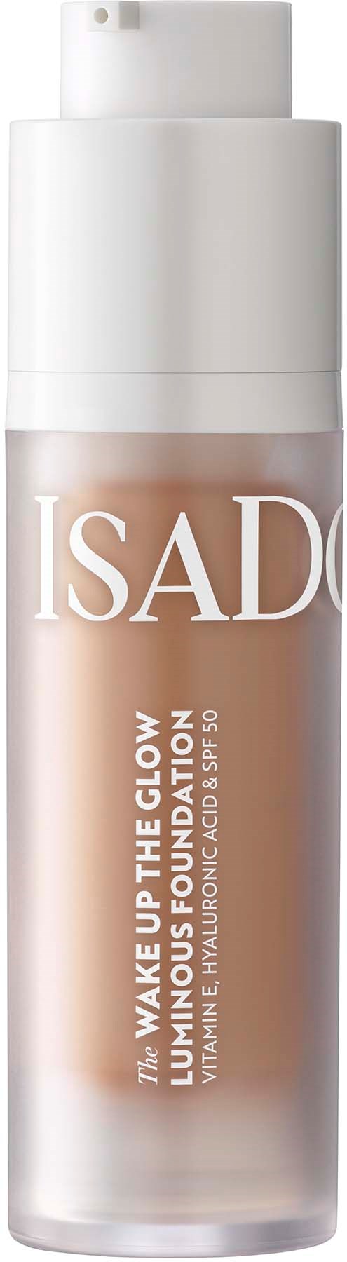 Eine Flasche ISADORA Wake Up The Glow Foundation mit Pumpkopf und beigefarbener Flüssigkeit.