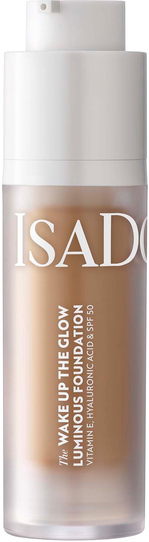 Eine Flasche Isado Wake Up The Glow Foundation mit Sonnenschutz. Die Flasche ist weiß mit Pumpkopf.