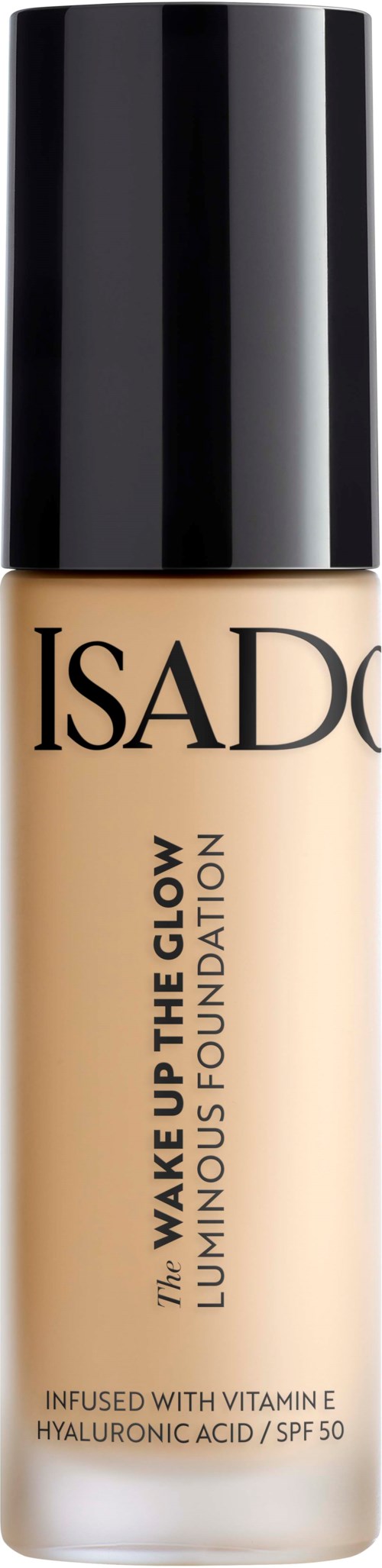 En flaska Isadore flytande foundation med svart lock, märkt 'Wake Up The Glow' med SPF 50 och vitamin E.