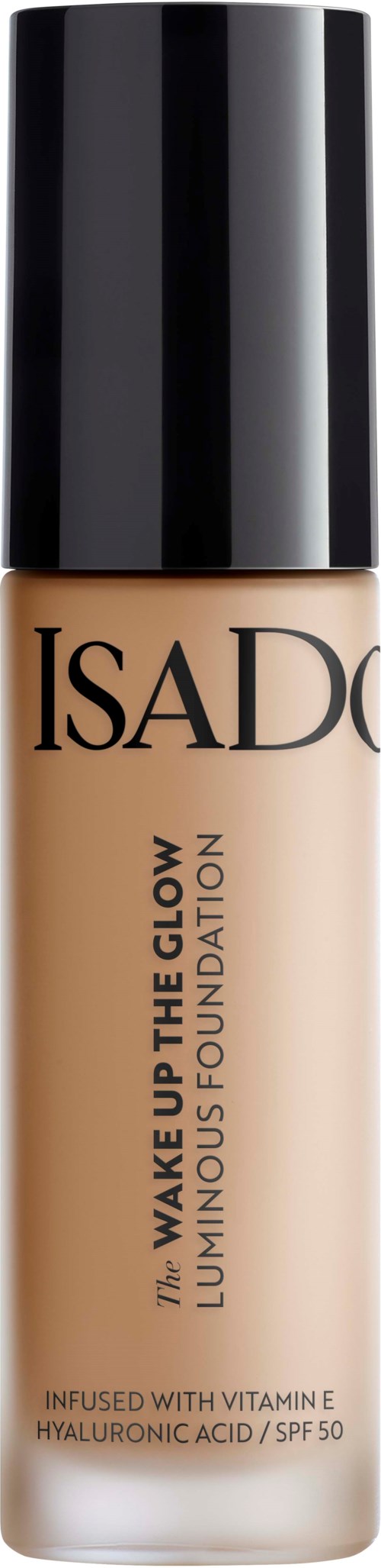 En flaska av IsaDora foundation med svart lock, märkt 'Wake Up The Glow' och nämner vitamin E och SPF 50.