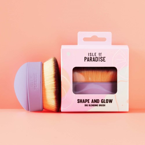 A makeup brush and a box labeled 'Shape and Glow' from Isle of Paradise. The brush has a purple handle and orange bristles.