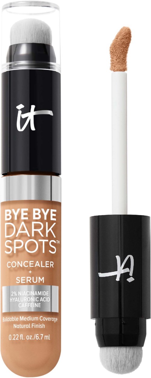 A concealer product with a white applicator wand, black cap, and beige-colored liquid inside a transparent tube.