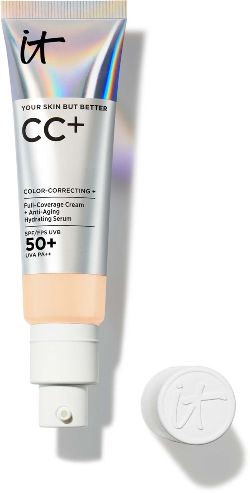 Eine Tube CC+ Creme mit SPF 50+ und ein weißer Deckel daneben. Die Tube hat glänzende, irisierende Farben und Text.