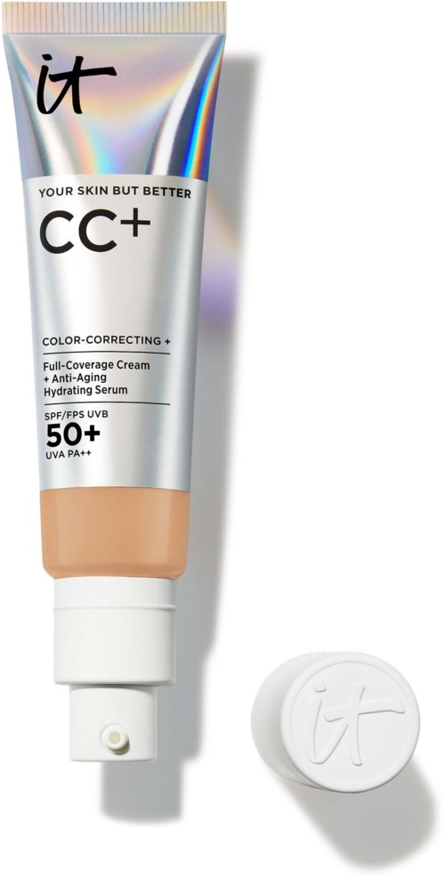 A tube of CC+ cream and a round cap with 'it' written on it, placed on a white background.