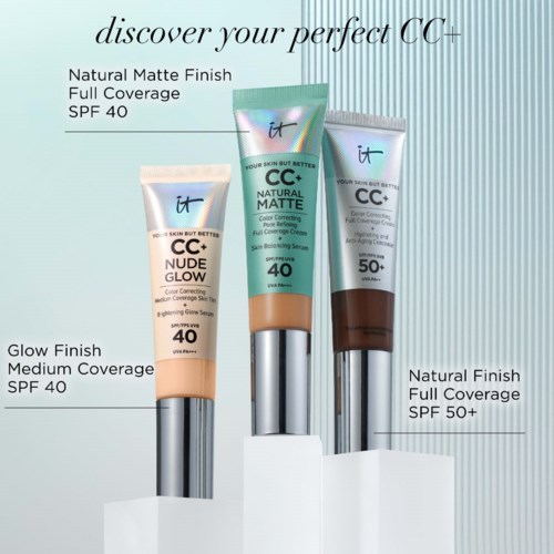 Three CC cream tubes with different shades and SPF levels, displayed on a stand.