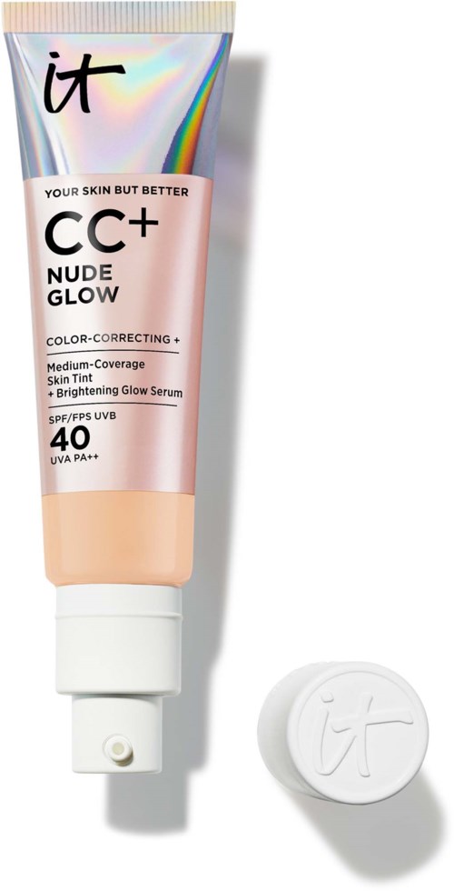 A tube of CC+ Nude Glow cream with SPF 40 and a white cap, lying on a light-colored surface.