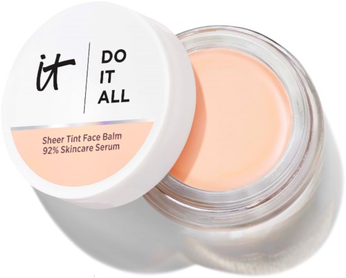 Avaa purkki Sheer Tint Face Balmilla, jossa on persikanväristä voidetta. Valkoinen kansi, jossa musta ja persikanvärinen teksti.