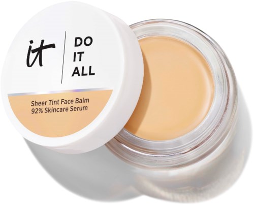 Lasipurkki, jossa on Sheer Tint Face Balm ja avattu kansi, paljastaa vaalean beigen voiteen sisällä.