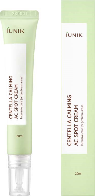 Een groene en witte tube en doos met IUNIK Centella Calming AC Spot Cream voor acne en kalmering van de huid.
