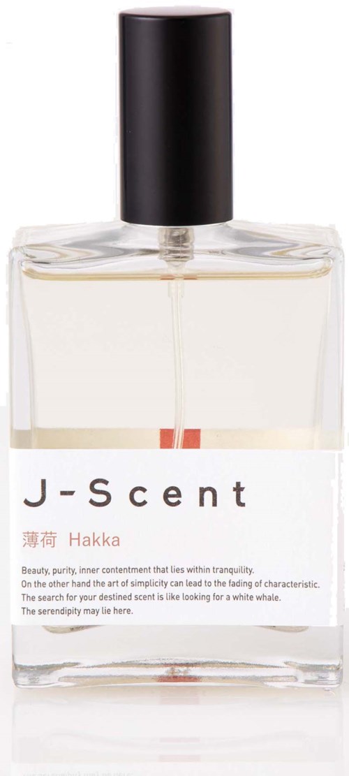 En transparent parfymflaska med svart lock, märkt J-Scent Hakka, med minimalistisk vit och röd text på fronten.