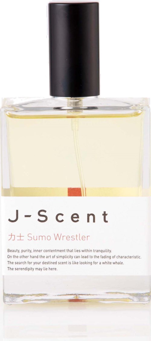 En tydlig parfyllåda med svart lock, märkt J-Scent Katsu Sumo Wrestler, fylld med ljusgul parfym.