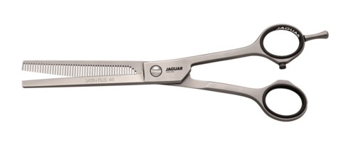 A pair of scissors with a straight blade and finger rings, made of metal, labeled 'JAGUAR'.