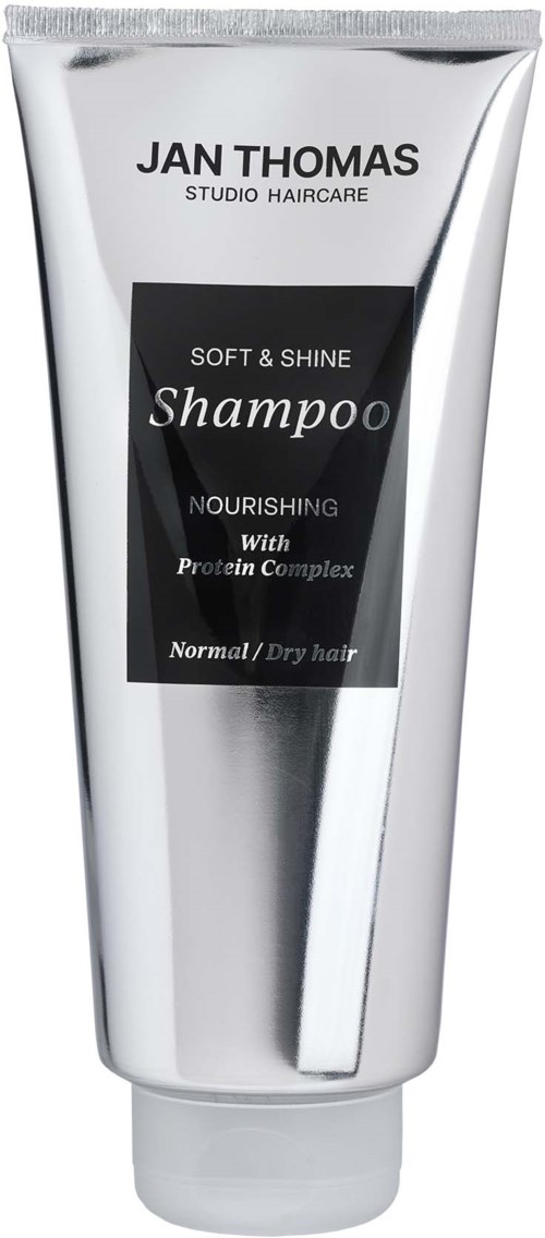 A white and silver tube of Jan Thomas shampoo for normal or dry hair with nourishing and protein complex features.