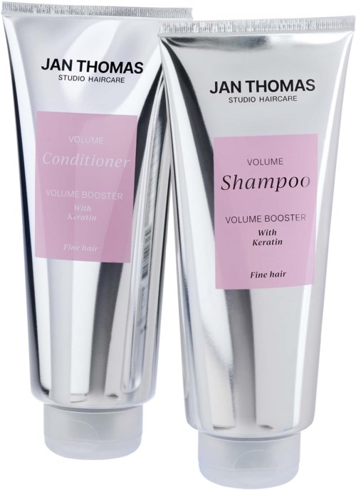 Two hair product tubes, one for shampoo and one for conditioner, with pink labels and silver packaging.