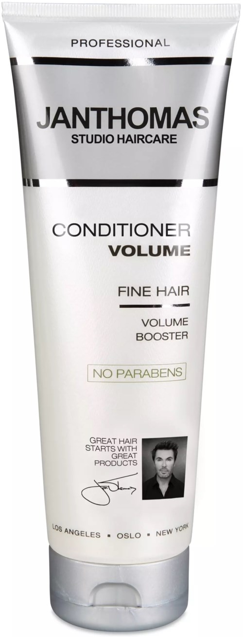 A white tube with black and gray text, advertising Janthomas hair conditioner for volume and no parabens.