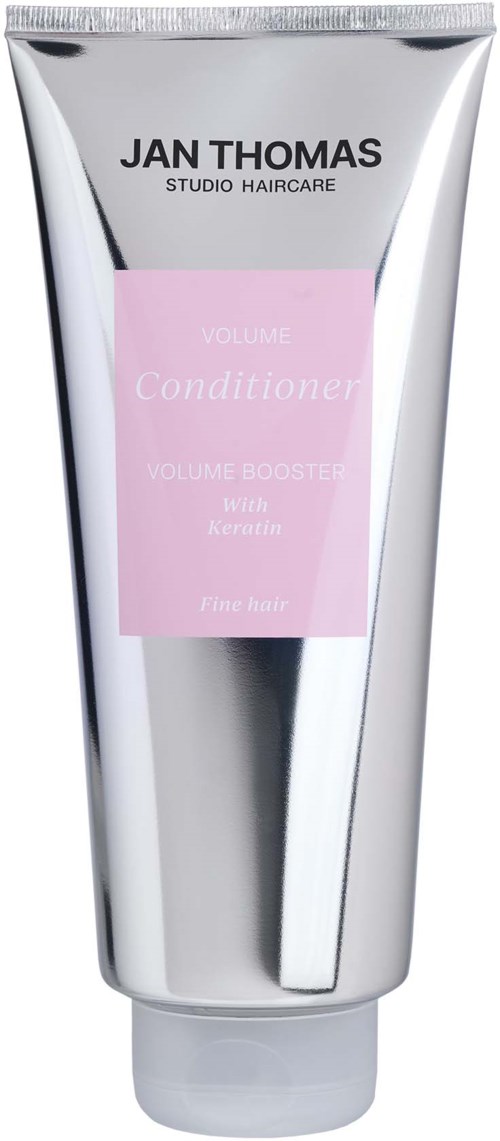 A silver tube labeled Jan Thomas Studio Haircare volume conditioner with keratin. It is a hair product.