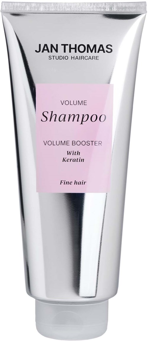 A silver and pink tube of Jan Thomas volume shampoo with keratin for fine hair.