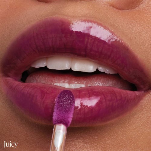 Lips are shiny, dark pink, with a gloss. A lip gloss wand is applying gloss on lips. The word "Juicy" is at the bottom.