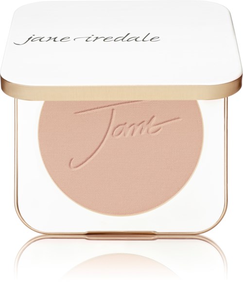 A compact with blush inside and a white lid with the name 'Jane Iredale' written on it.