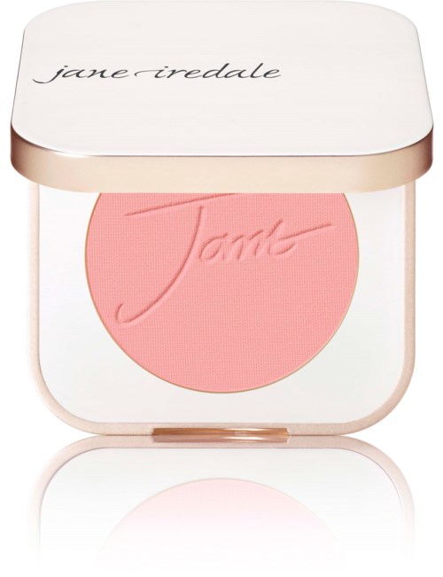 A pink blush in a white and rose gold compact with 'jane iredale' written on the lid.