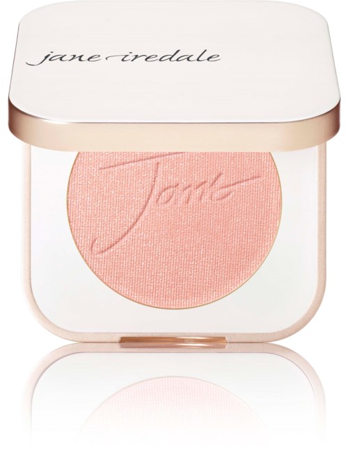 En rosa rouge i ett runt kompakt med vit lock, märkt 'jane iredale'.