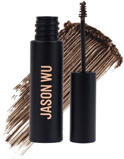 En svart mascara-rör med namnet Jason Wu, med borsten synlig, mot en brunskrubbig bakgrund.