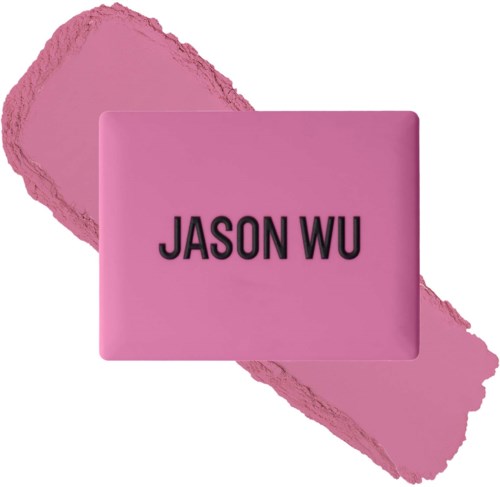 Eine rosa Seife mit schwarzem Text 'JASON WU' auf einem rosa Fleckhintergrund.