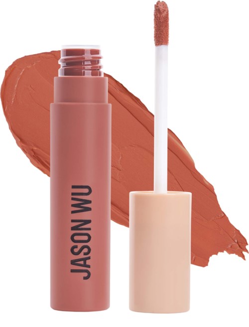 Ett läppstift med rosa nyans, capen är avlägsnad för att visa applikatorn och läppfärgsprovet. Märket är Jason Wu.