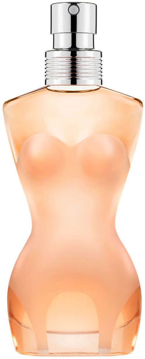 A perfume bottle shaped like a woman's body with a silver cap and peach-colored liquid inside.