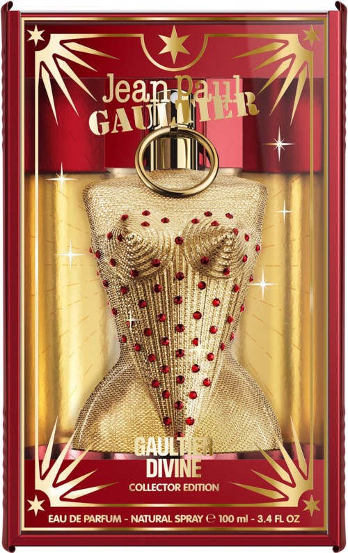 En parfymflaska med guldnät och röda prickar, i en röd och gyllene box med Jean Paul Gaultier Divine Collector Edition.
