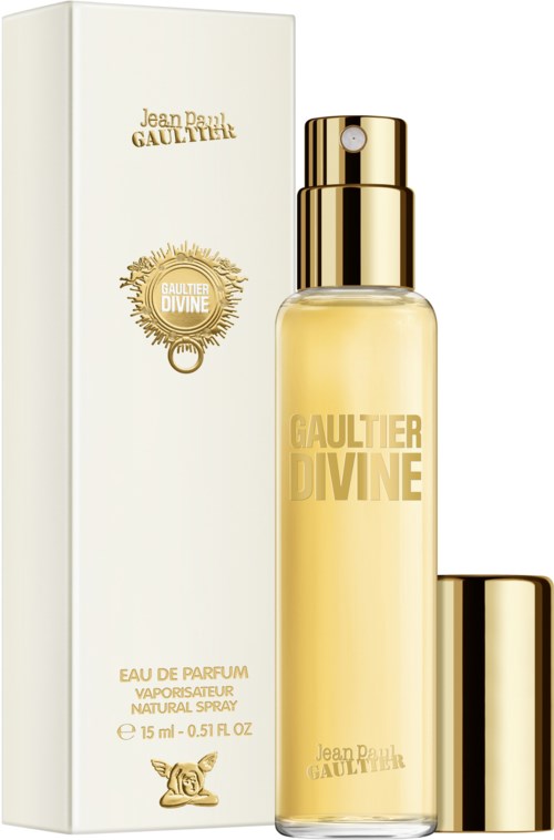 En parfylflaska märkt 'Gaultier Divine' bredvid en vit låda. Flaskan har ett guldlock och spraytop.