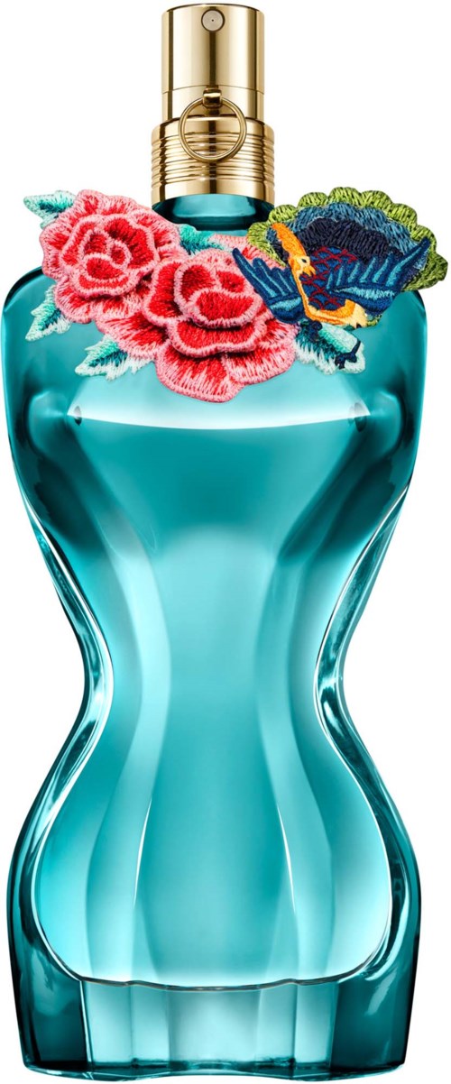 A perfume bottle with a blue liquid, decorated with colorful embroidered flowers and a butterfly.