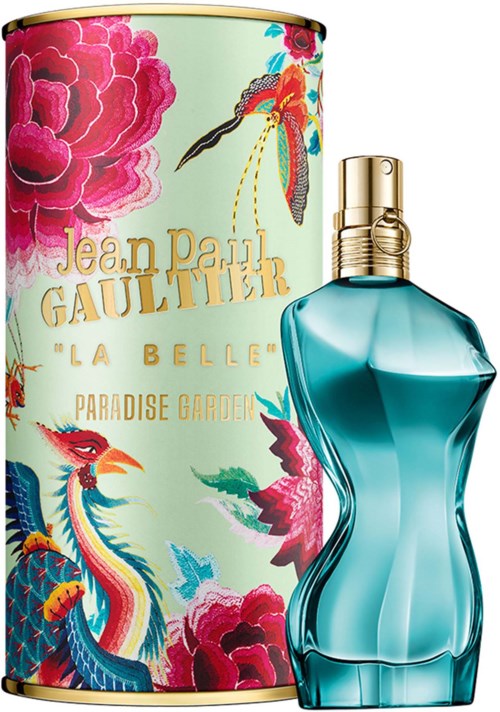 A perfume bottle with a blue curved design and gold cap, alongside a colorful floral and bird-themed box.