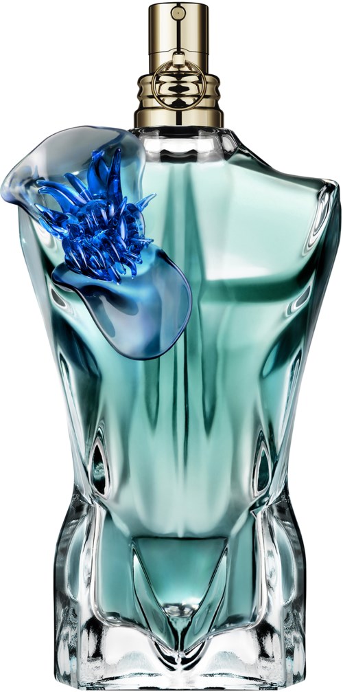 A perfume bottle with a blue flower decoration and clear glass, featuring a golden spray nozzle.