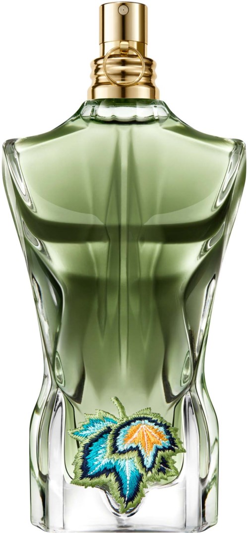 Ein Parfümflasche mit grünem Inhalt, goldener Kappe und einem dekorativen Blattlogo am Boden.