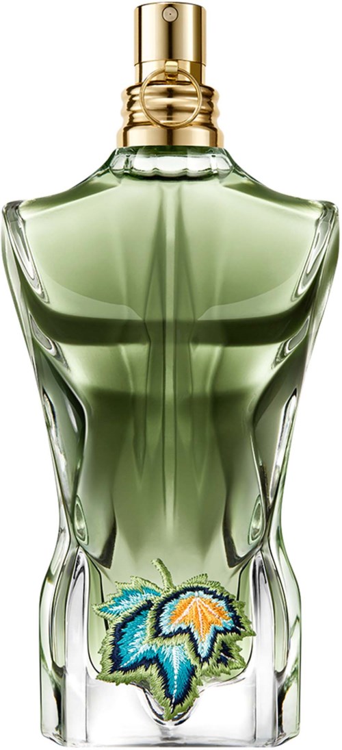 Ein Parfümflasche mit grünem Inhalt, geformt wie ein weiblicher Körper, und ein farbiges Blattform-Design am unteren Rand.