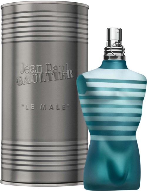 Ein Parfümflasche in Form eines Frauen torso mit blauen und weißen Streifen neben einer silbernen Zylinder.