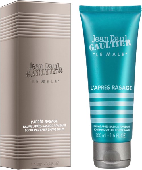Een kalmerende aftershave balsem in een turquoise tube en een beige doos, allebei gelabeld "Jean Paul Gaultier."